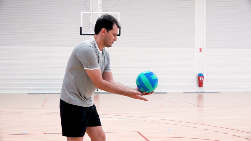 Man Serves Volleyball